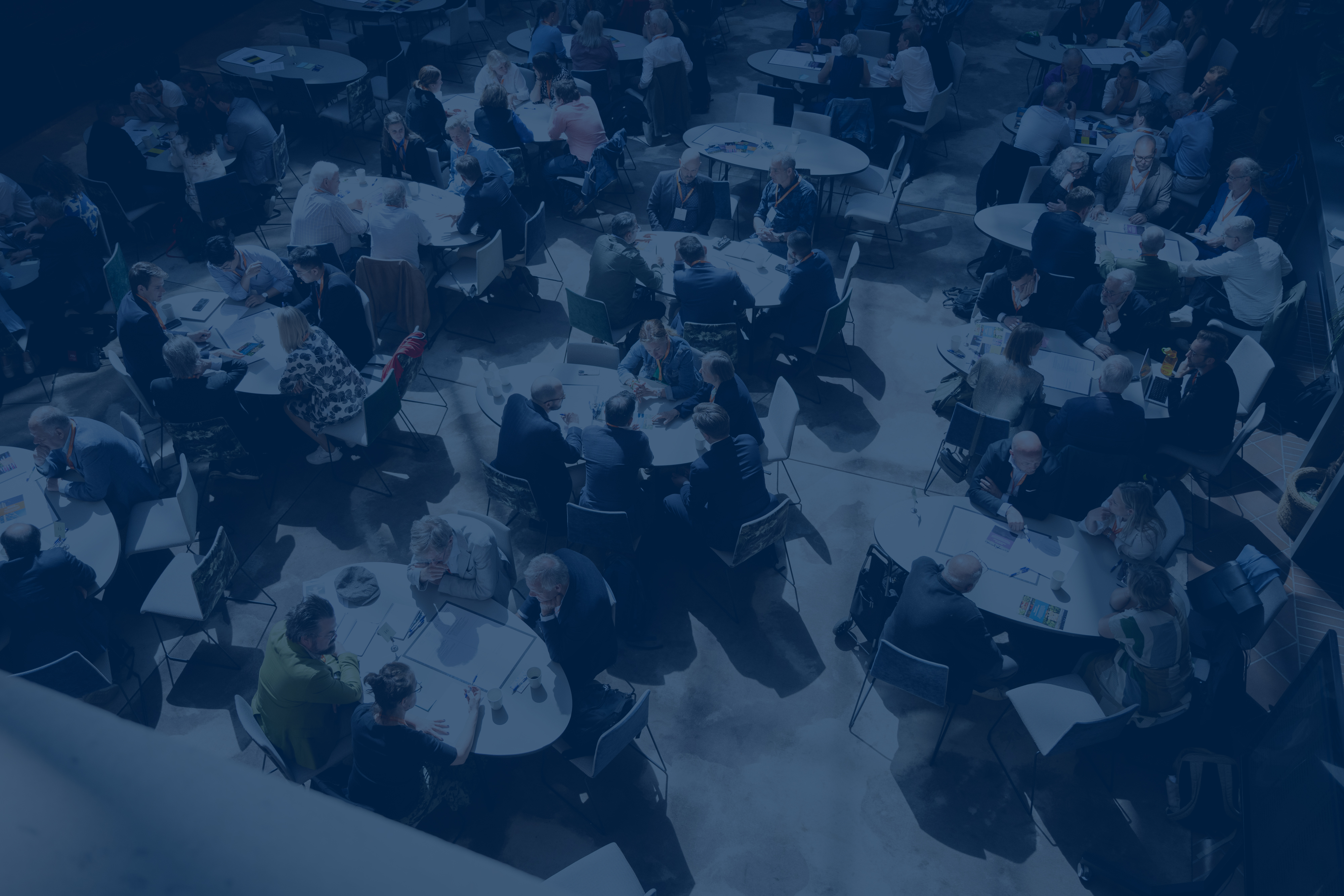 Round tables with people seen from above